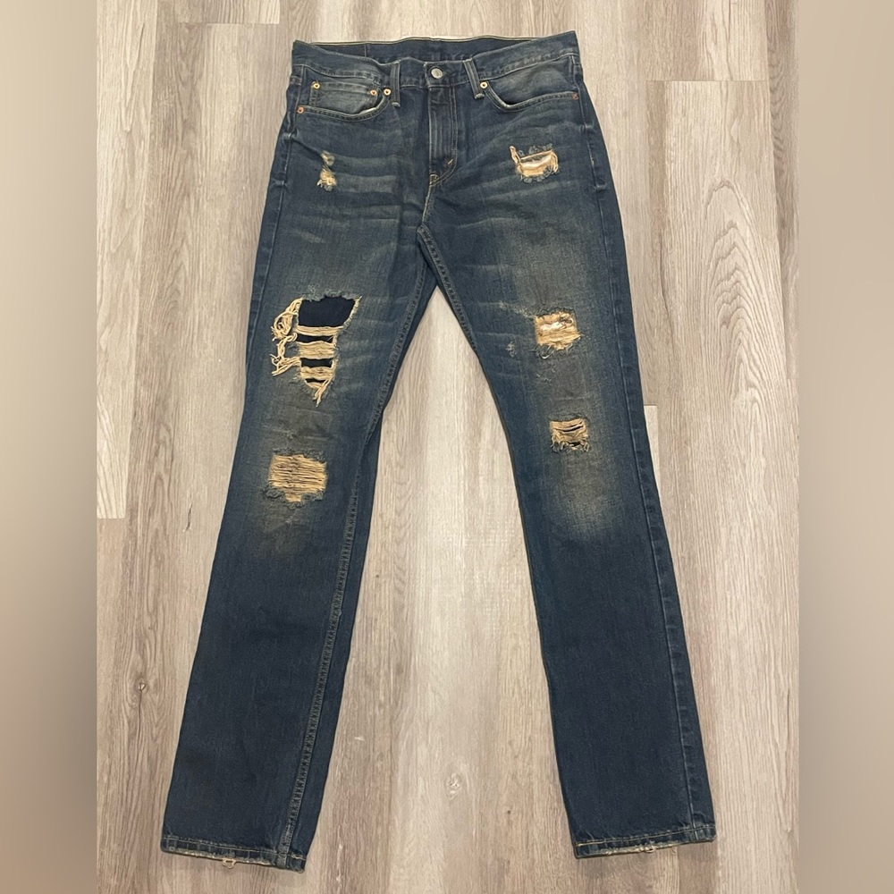 Levi’s Strauss & Co. dark blue jeans, waist 34 and length 36.